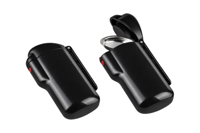 Two black portable ashtrays, one closed and one with its lid open